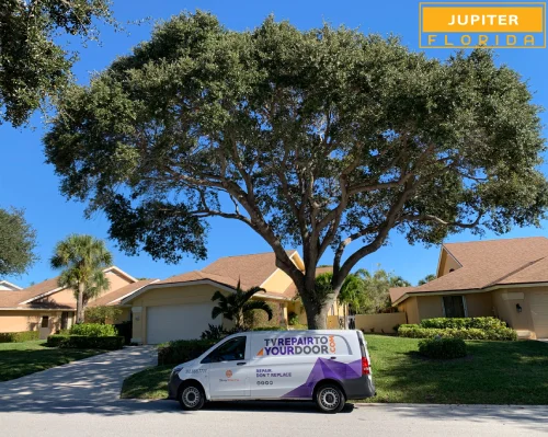 TV Repair Service truck parked in front of a home in Jupiter, Florida